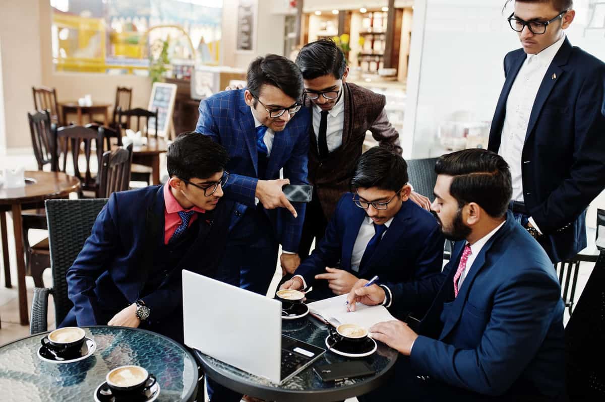 Leaders around a table working through a plan
