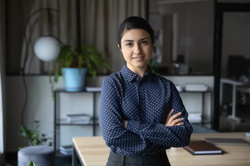 A senior leader standing in a modern office