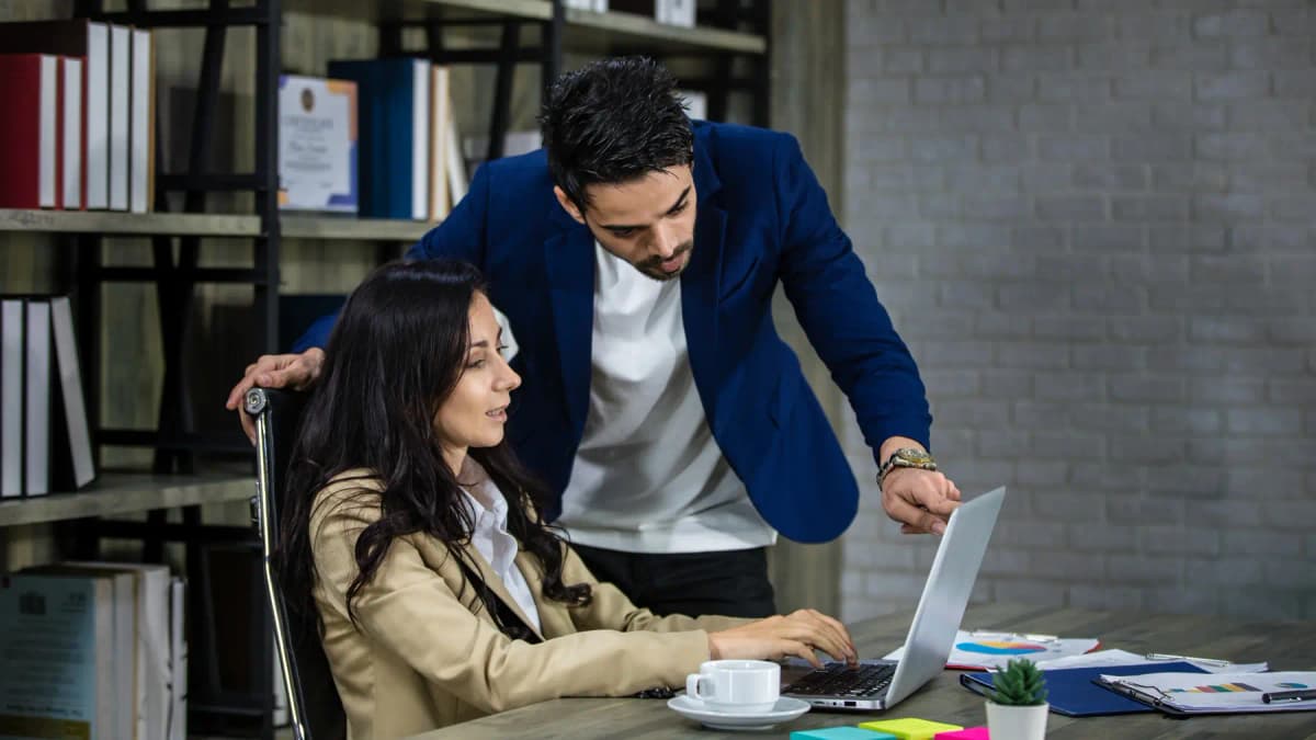 Two executives discussing a plan at a desk