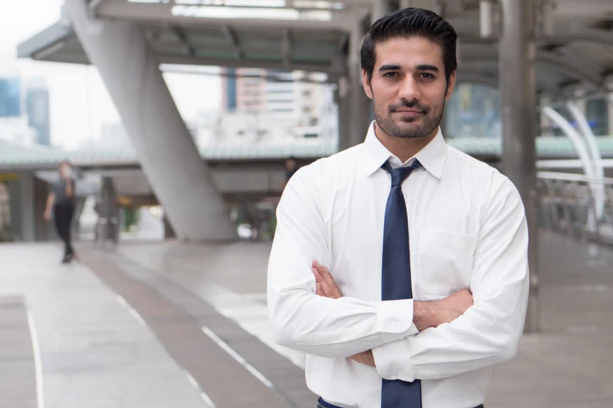 A confident business leader with arms folded