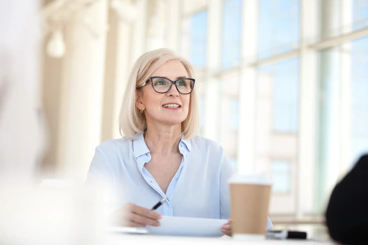 An experienced woman leader speaking in a meeting
