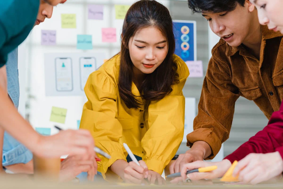 A product and design team reviewing app layouts