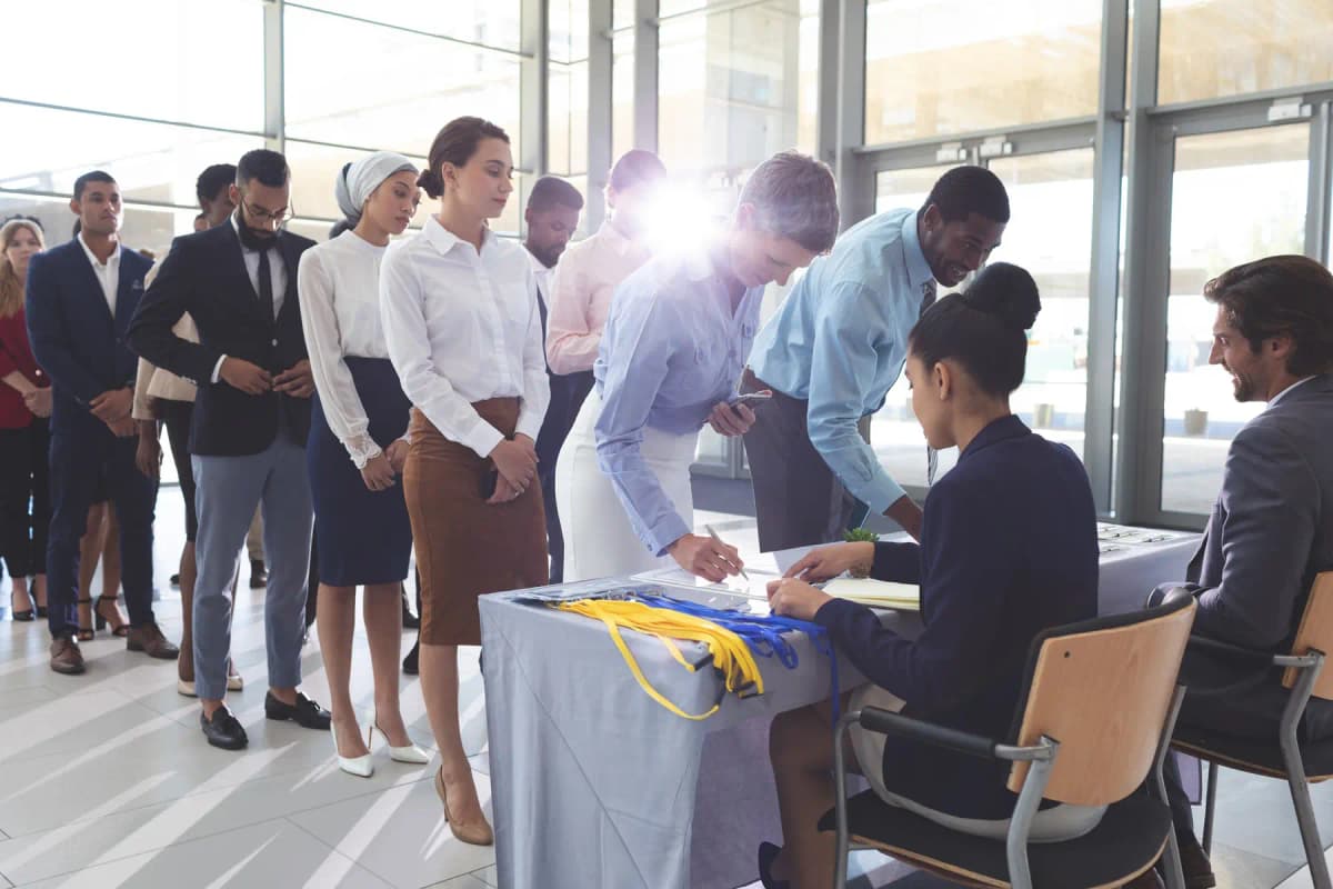 Guests signing in at an event registration desk